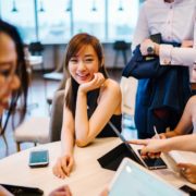 Asian woman smiling in professional setting
